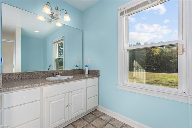 bathroom featuring plenty of natural light, vanity, and tile patterned floors