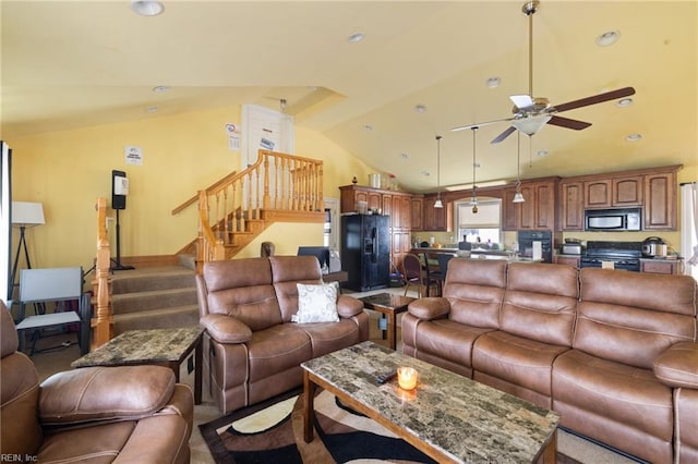 living room with ceiling fan and lofted ceiling