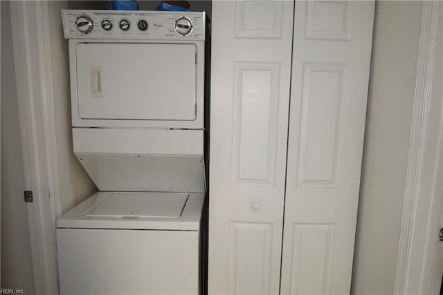 laundry area featuring laundry area and stacked washing maching and dryer