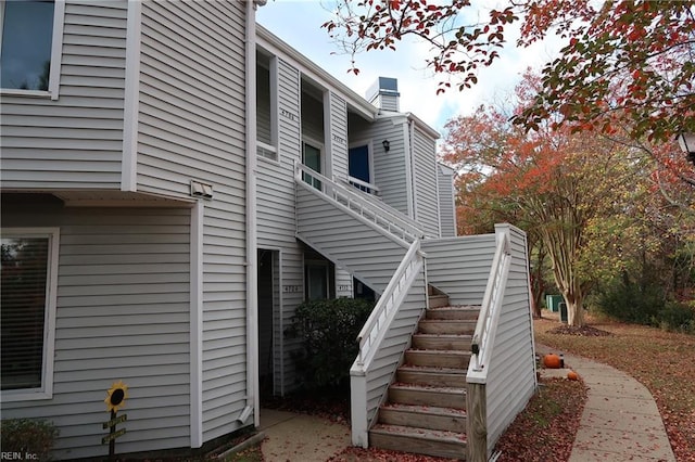 view of side of home with stairway