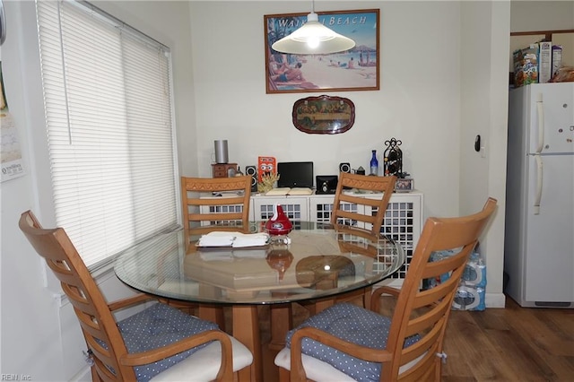 dining space featuring dark hardwood / wood-style floors