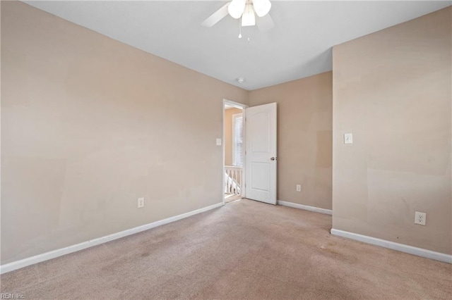 carpeted empty room with ceiling fan