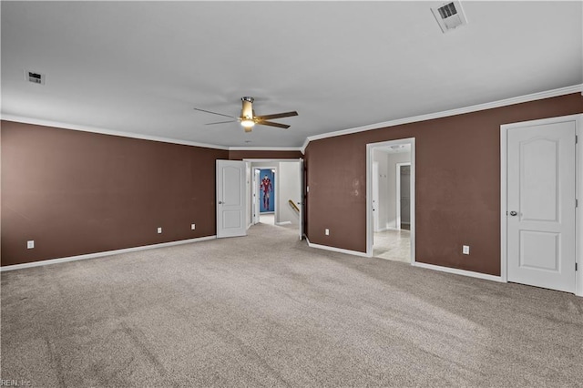 unfurnished bedroom with ornamental molding, light carpet, and ceiling fan