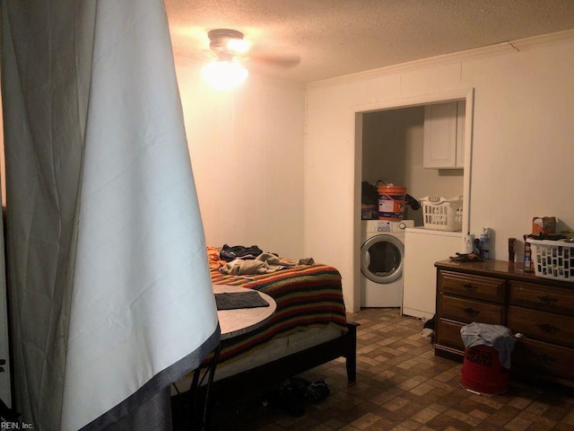 bedroom featuring ceiling fan, crown molding, separate washer and dryer, and a textured ceiling