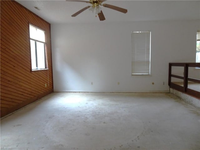 unfurnished room with ceiling fan