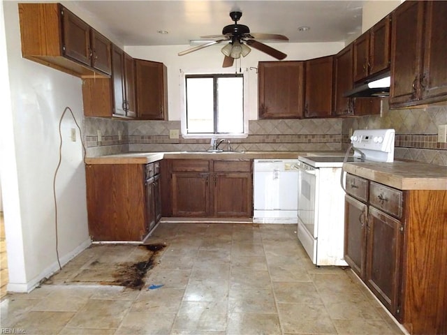 kitchen with white appliances, ceiling fan, and decorative backsplash