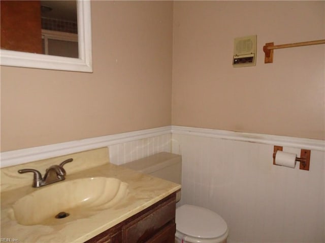 bathroom with vanity and toilet