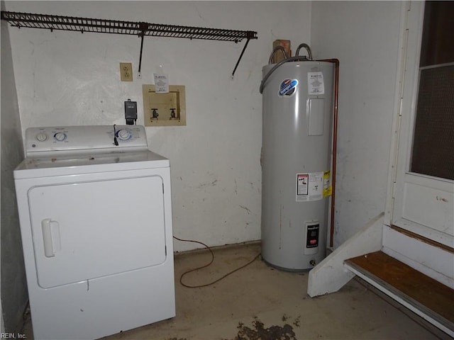 laundry room featuring electric water heater and washer / dryer