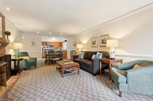 carpeted living room with a fireplace and crown molding