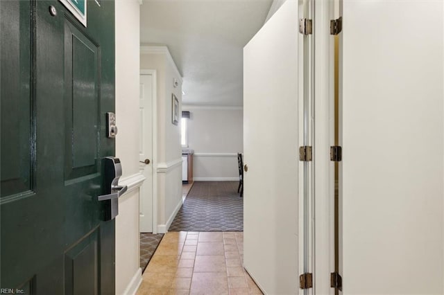 hallway featuring crown molding