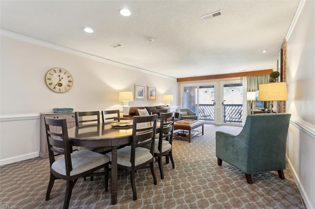 dining area featuring french doors and ornamental molding