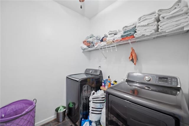 laundry area featuring ceiling fan and separate washer and dryer