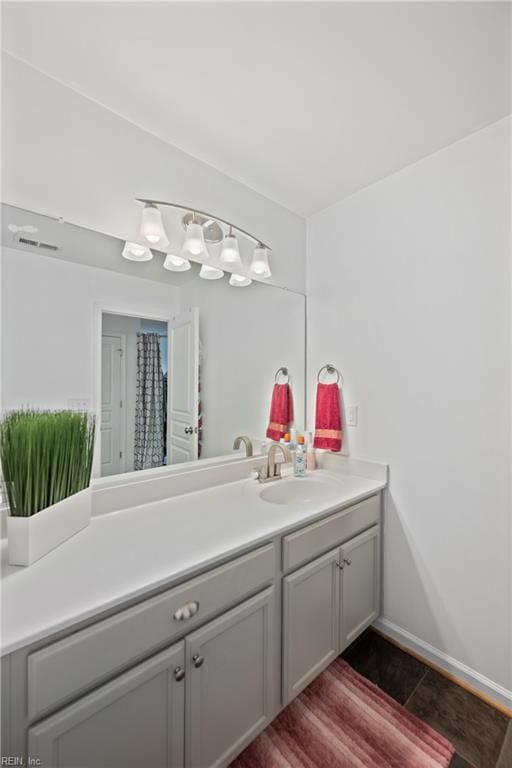 bathroom featuring hardwood / wood-style floors and vanity