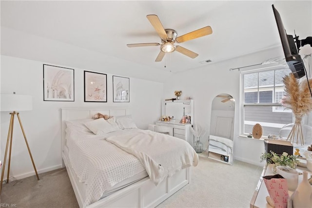 bedroom featuring ceiling fan and light colored carpet