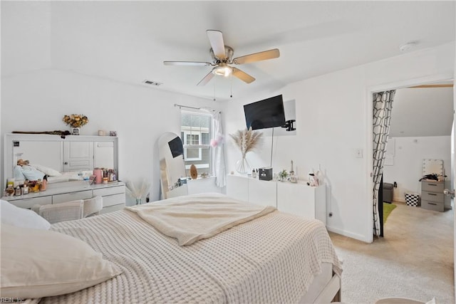 bedroom featuring ceiling fan and light carpet