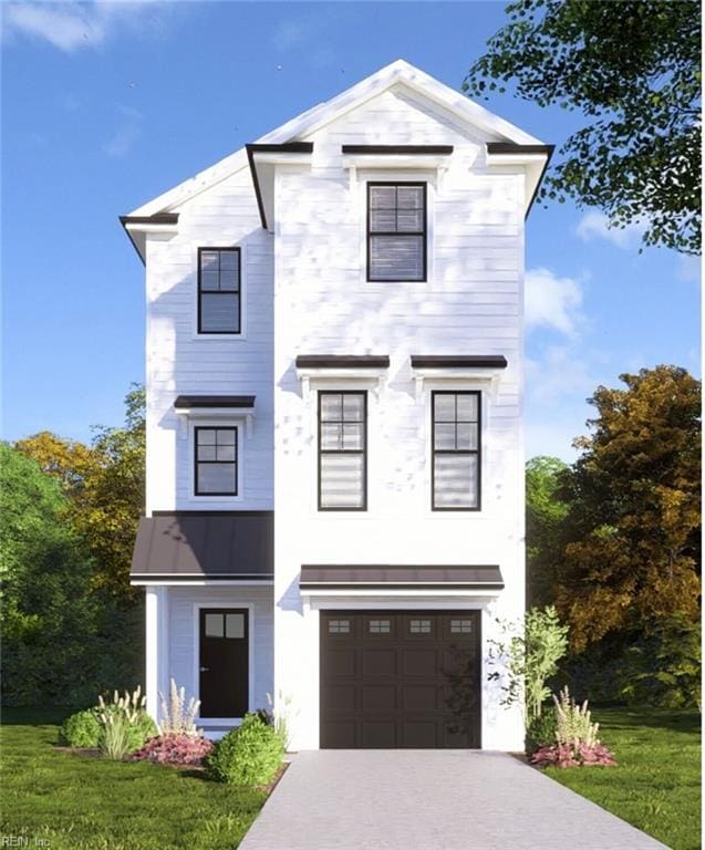 view of front facade with a garage and a front yard