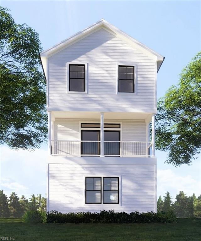 view of side of property with a balcony