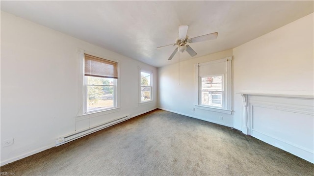 carpeted spare room with ceiling fan and a baseboard heating unit