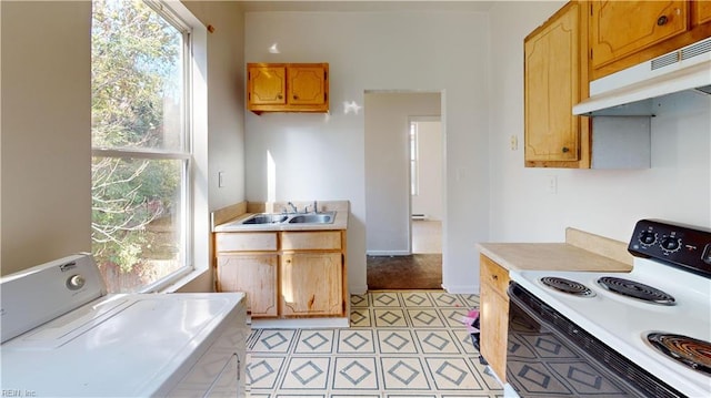 kitchen featuring washer / clothes dryer, sink, white electric range, and a healthy amount of sunlight