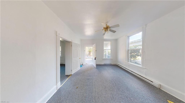 interior space with ceiling fan, a baseboard radiator, and carpet flooring