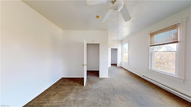 unfurnished bedroom with baseboard heating, carpet, and ceiling fan