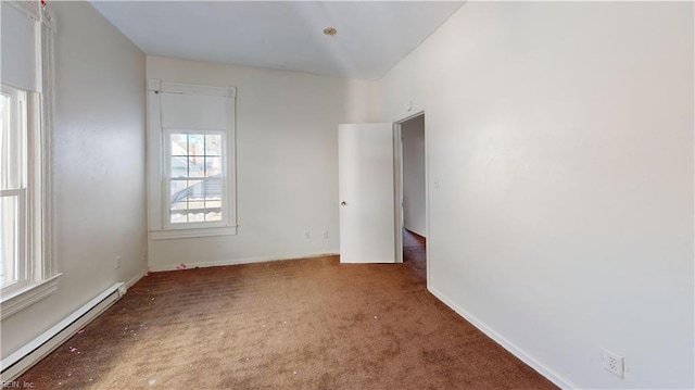 carpeted empty room with a baseboard radiator and a healthy amount of sunlight