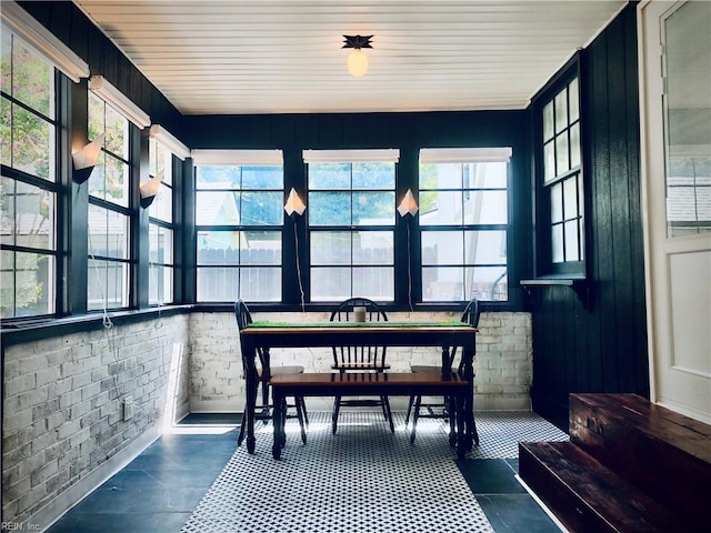 sunroom / solarium featuring wood ceiling