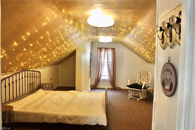 carpeted bedroom featuring lofted ceiling