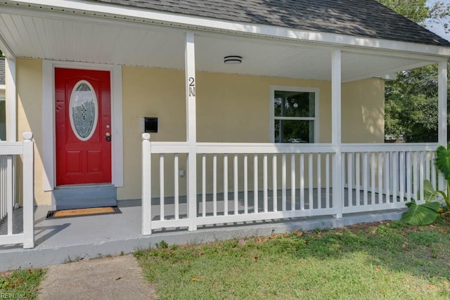 doorway to property featuring covered porch