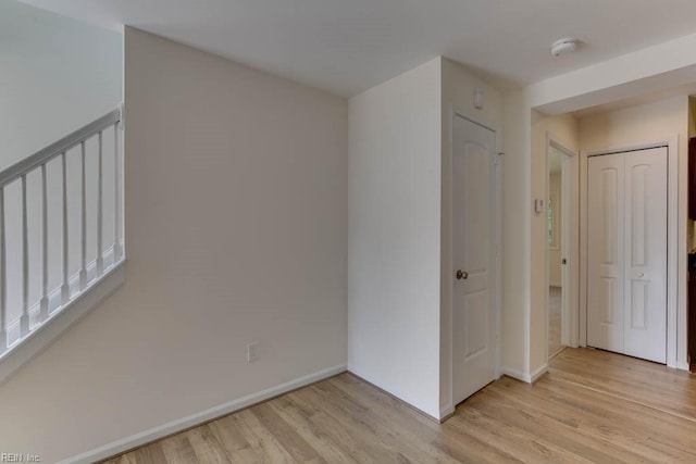 unfurnished room featuring light wood-type flooring