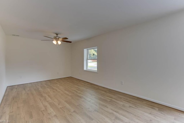 spare room with ceiling fan and light hardwood / wood-style flooring