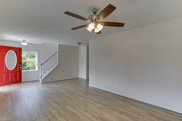 foyer featuring ceiling fan and light wood-type flooring