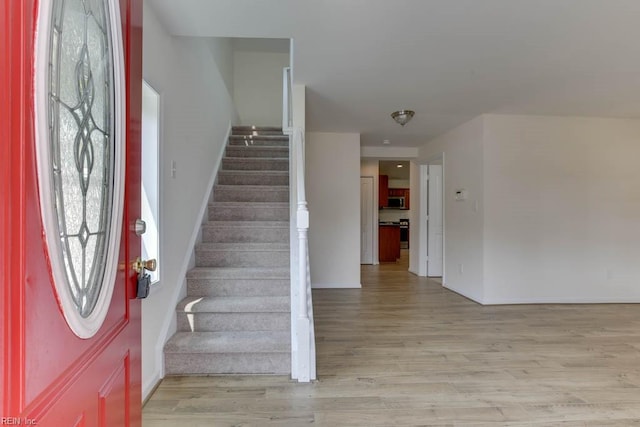 entryway featuring light wood-type flooring and plenty of natural light