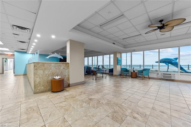 building lobby featuring a water view