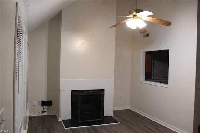 unfurnished living room featuring ceiling fan, dark hardwood / wood-style floors, and lofted ceiling