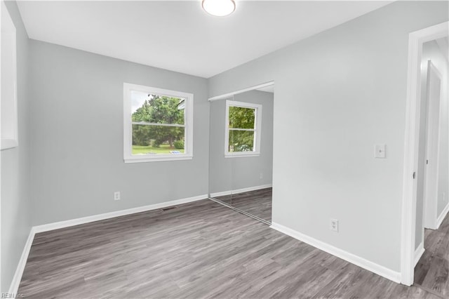 unfurnished room featuring dark hardwood / wood-style floors