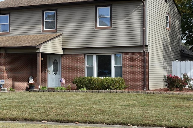 view of property featuring a front yard