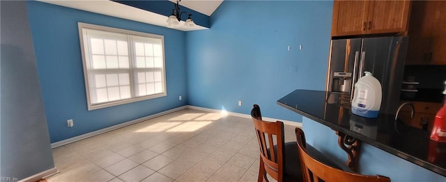 kitchen featuring a notable chandelier and light tile patterned floors