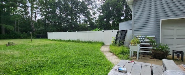 view of yard featuring a garage