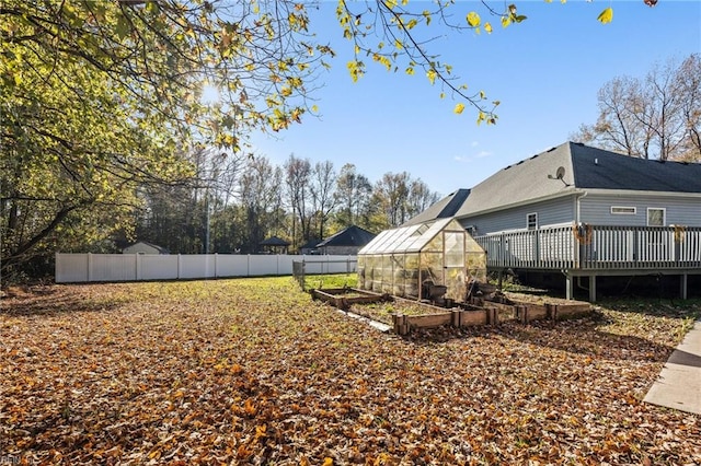 view of yard featuring an outbuilding and a deck