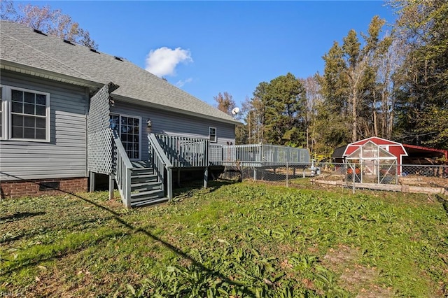 view of yard with an outbuilding and a deck