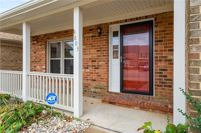 doorway to property with a porch