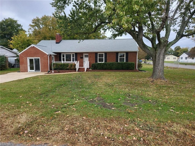 ranch-style home with a front lawn