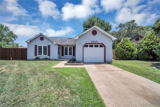 single story home with a garage and a front lawn