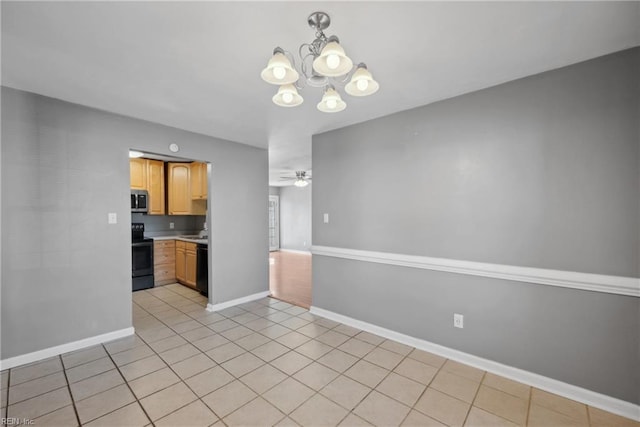 kitchen featuring ceiling fan with notable chandelier, light tile patterned floors, sink, and electric range