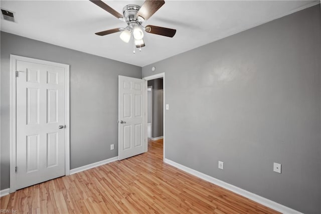 unfurnished bedroom with light wood-type flooring and ceiling fan