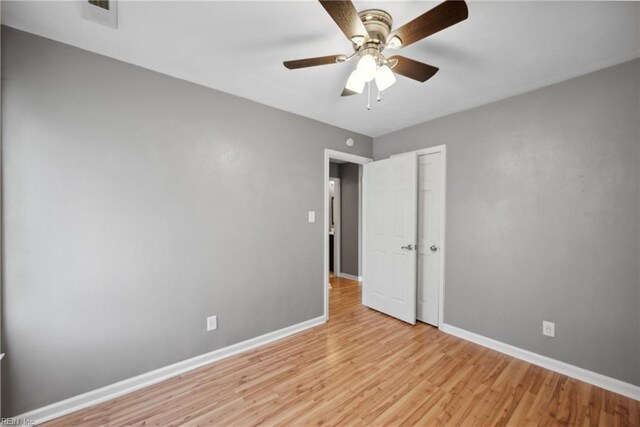 unfurnished bedroom featuring light hardwood / wood-style floors and ceiling fan