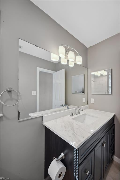 bathroom featuring tile patterned flooring and vanity