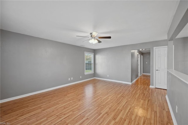 spare room featuring light hardwood / wood-style flooring and ceiling fan