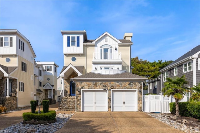 view of front of house featuring a balcony and a garage